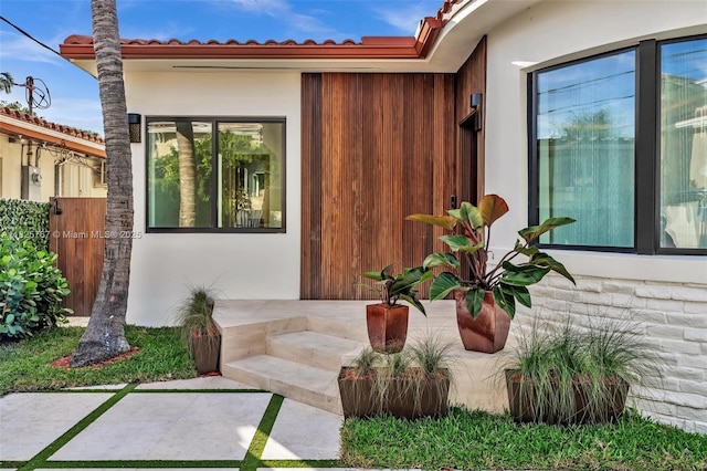 9448 Abbott Ave, Surfside, FL 33154 - property entrance with stone siding and stucco siding