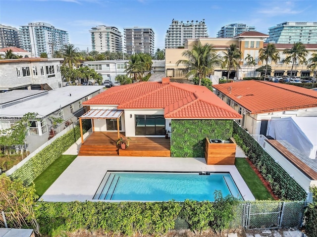 9448 Abbott Ave, Surfside, FL 33154 - view of pool featuring a deck, a fenced backyard, and a view of city