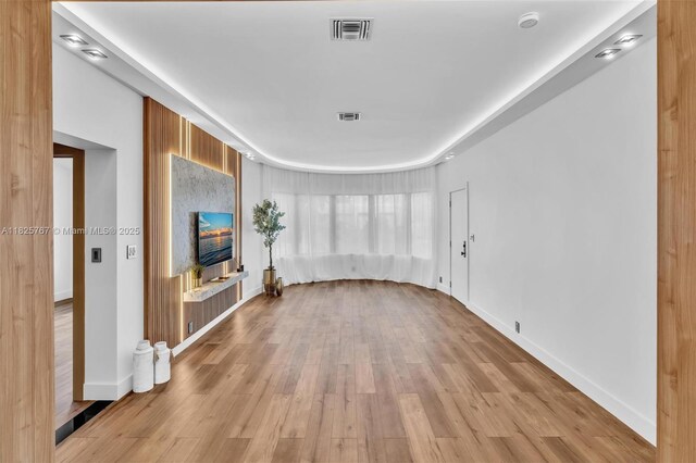 9448 Abbott Ave, Surfside, FL 33154 - unfurnished living room featuring light wood-style flooring and baseboards