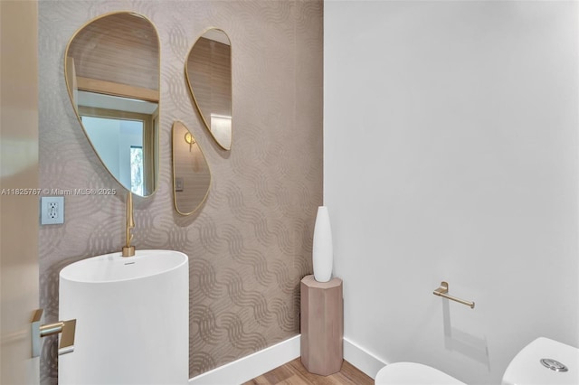 9448 Abbott Ave, Surfside, FL 33154 - half bathroom with wallpapered walls and wood finished floors