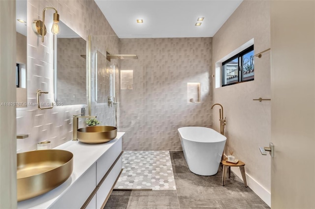 9448 Abbott Ave, Surfside, FL 33154 - full bath with walk in shower, tile walls, double vanity, a freestanding tub, and tile patterned flooring