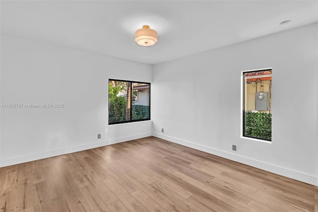 9448 Abbott Ave, Surfside, FL 33154 - empty room with baseboards and light wood-type flooring