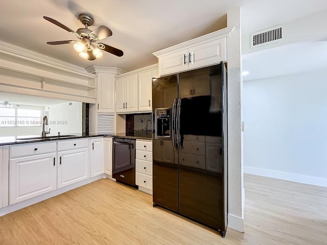 2607 NW 104th Ave Unit 206, Sunrise, FL 33322 - kitchen with black appliances, dark countertops, a ceiling fan, and light wood-style floors