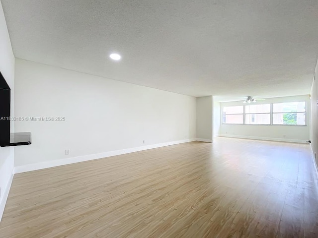 2607 NW 104th Ave Unit 206, Sunrise, FL 33322 - unfurnished room featuring light wood-type flooring, a textured ceiling, and recessed lighting