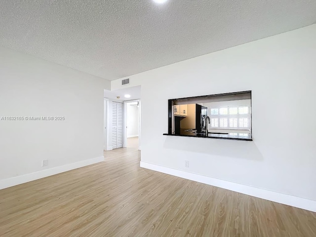 2607 NW 104th Ave Unit 206, Sunrise, FL 33322 - empty room with wood finished floors and a textured ceiling