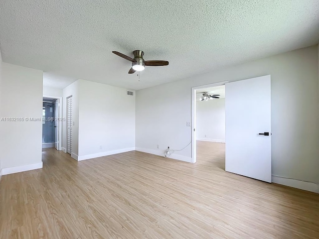 2607 NW 104th Ave Unit 206, Sunrise, FL 33322 - empty room featuring ceiling fan, light wood finished floors, and a textured ceiling