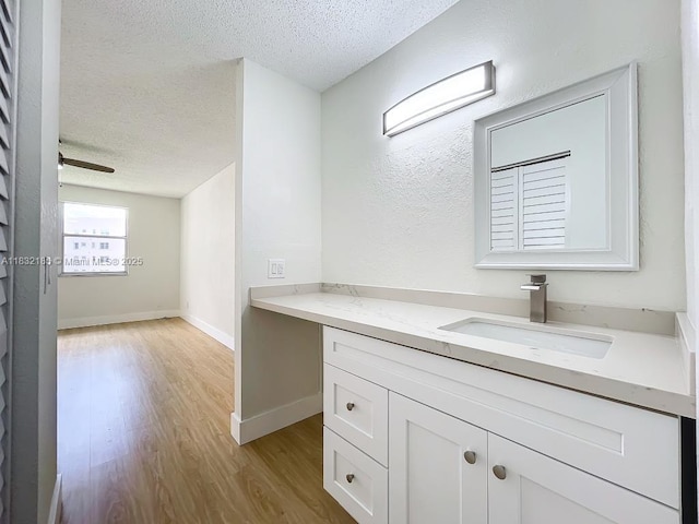 2607 NW 104th Ave Unit 206, Sunrise, FL 33322 - bathroom with a textured ceiling, wood finished floors, and vanity