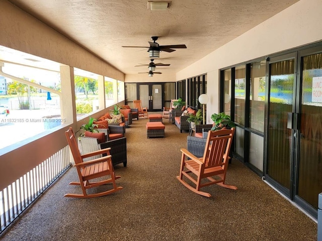 2607 NW 104th Ave Unit 206, Sunrise, FL 33322 - sunroom with a textured ceiling, ceiling fan, and outdoor lounge area