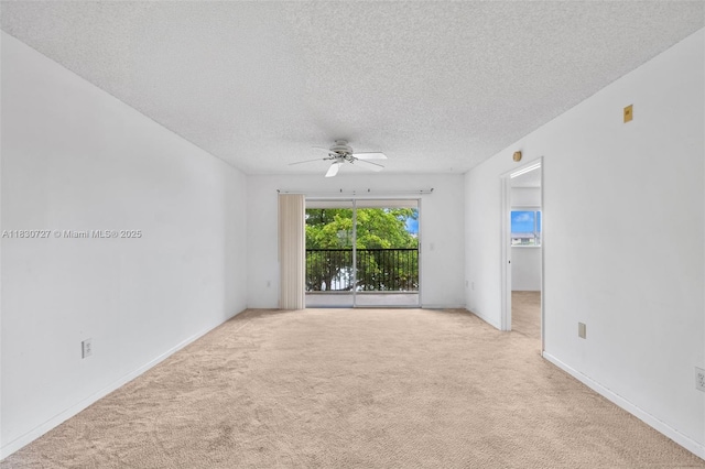 13701 SW 12th St Unit 405A, Pembroke Pines, FL 33027 - spare room featuring a ceiling fan, carpet, and a textured ceiling