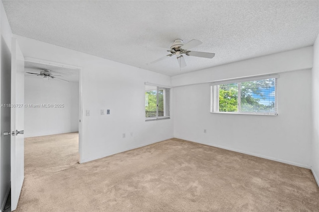 13701 SW 12th St Unit 405A, Pembroke Pines, FL 33027 - unfurnished room with a ceiling fan, carpet, and a textured ceiling