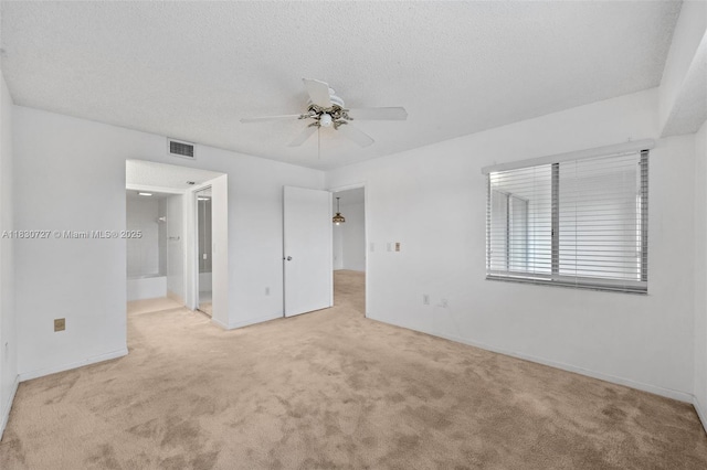 13701 SW 12th St Unit 405A, Pembroke Pines, FL 33027 - unfurnished bedroom featuring carpet floors, a textured ceiling, ensuite bath, and a ceiling fan