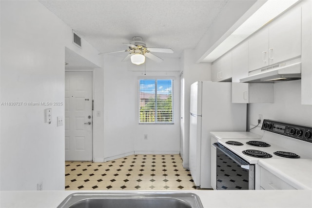 13701 SW 12th St Unit 405A, Pembroke Pines, FL 33027 - kitchen featuring under cabinet range hood, white appliances, light floors, white cabinetry, and ceiling fan