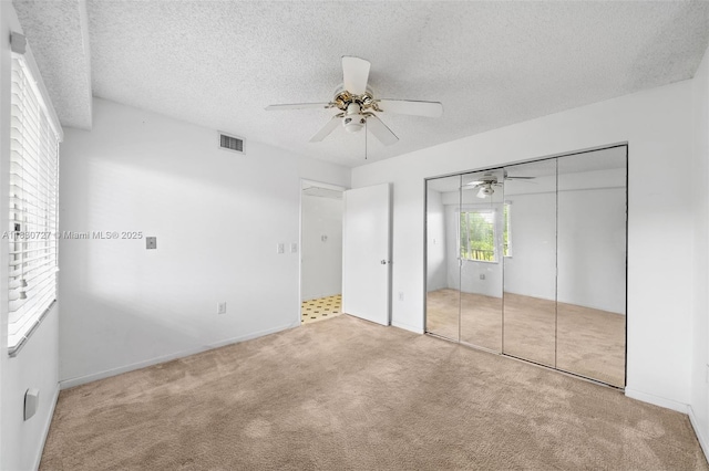 13701 SW 12th St Unit 405A, Pembroke Pines, FL 33027 - unfurnished bedroom featuring carpet floors, a textured ceiling, and ceiling fan
