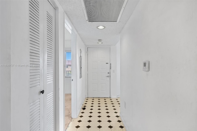13701 SW 12th St Unit 405A, Pembroke Pines, FL 33027 - hall with a textured ceiling, light floors, and recessed lighting