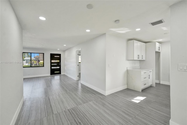 212 SW 11th Ave, Dania Beach, FL 33004 - unfurnished living room featuring baseboards and recessed lighting