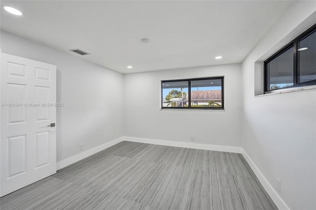 212 SW 11th Ave, Dania Beach, FL 33004 - spare room featuring recessed lighting and wood finished floors