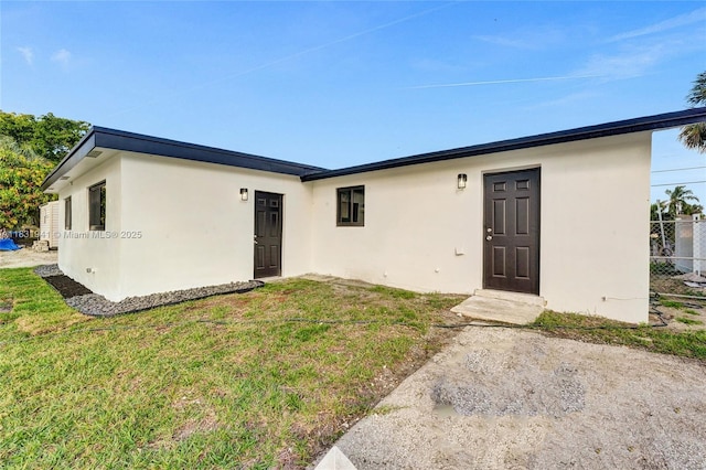 212 SW 11th Ave, Dania Beach, FL 33004 - view of front of house featuring stucco siding and a front lawn