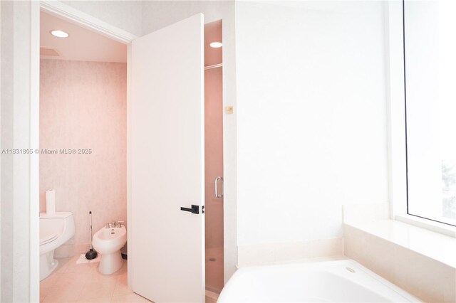 18101 Collins Ave Unit 701, Sunny Isles Beach, FL 33160 - full bath with a garden tub, a bidet, and tile patterned flooring