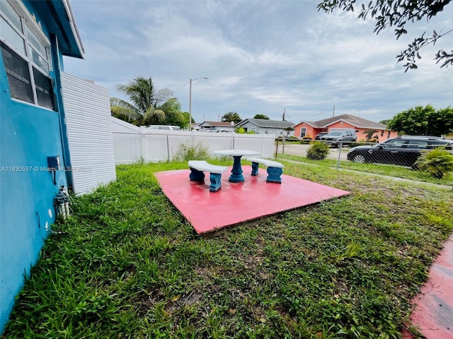 1344 W 10th St, Riviera Beach, FL 33404 - fenced backyard featuring a patio and a residential view