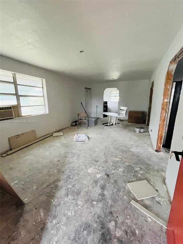 1344 W 10th St, Riviera Beach, FL 33404 - unfurnished living room with arched walkways and cooling unit