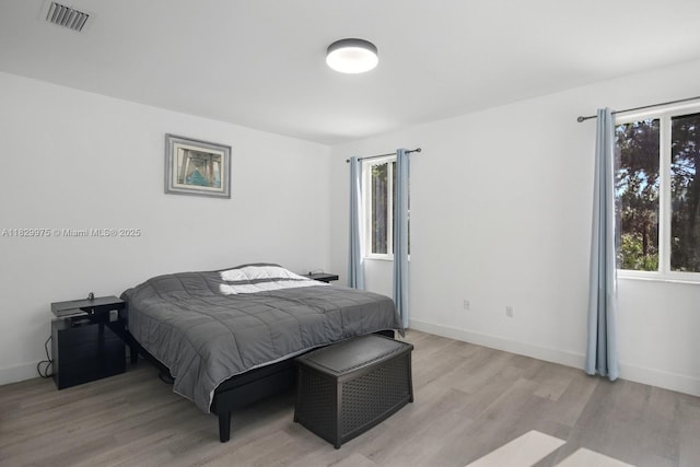 18350 SW 139th Path, Miami, FL 33177 - bedroom with multiple windows and light wood-type flooring