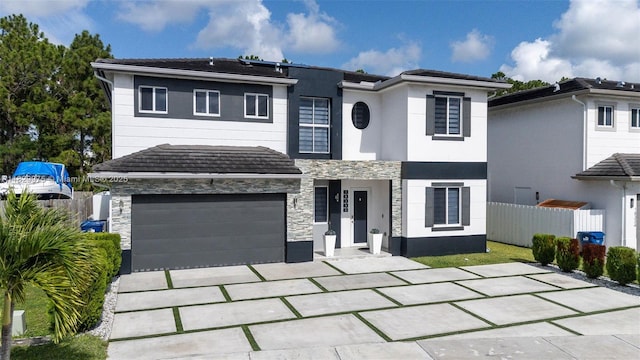 18350 SW 139th Path, Miami, FL 33177 - view of front of property featuring stone siding, concrete driveway, an attached garage, and stucco siding