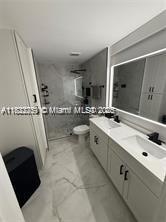11350 SW 132nd Ct, Miami, FL 33186 - bathroom featuring double vanity and a stall shower