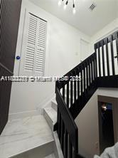 11350 SW 132nd Ct, Miami, FL 33186 - staircase featuring a chandelier