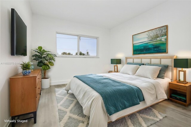 524 NW 7th Ct, Boynton Beach, FL 33426 - bedroom featuring light wood finished floors and baseboards