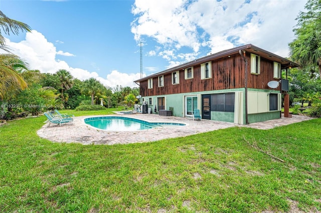 576 Marshall Rd, West Palm Beach, FL 33413 - swimming pool featuring a patio area and a lawn