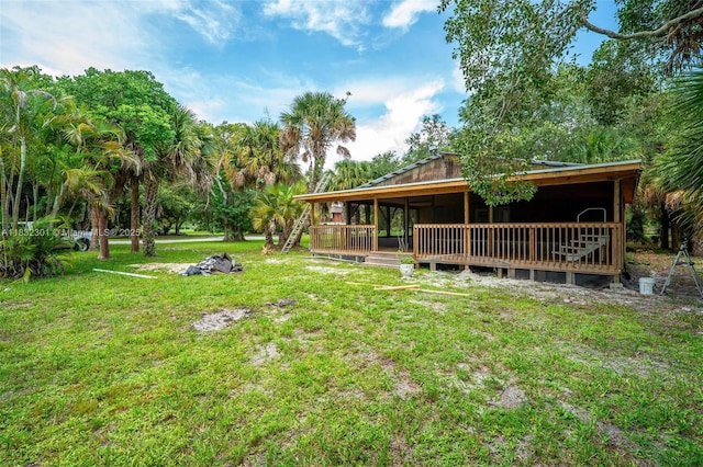 576 Marshall Rd, West Palm Beach, FL 33413 - view of green lawn with a deck