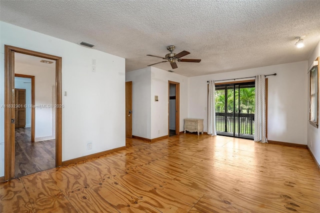 576 Marshall Rd, West Palm Beach, FL 33413 - unfurnished room with wood finished floors, a textured ceiling, and ceiling fan