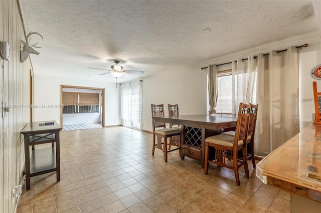 576 Marshall Rd, West Palm Beach, FL 33413 - dining space featuring a ceiling fan and a textured ceiling