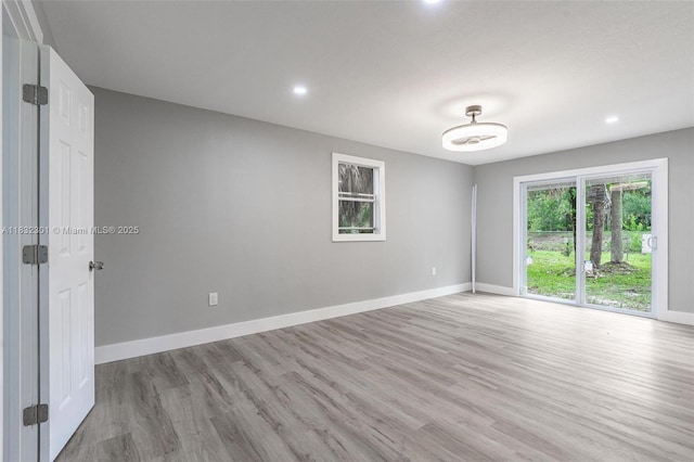 576 Marshall Rd, West Palm Beach, FL 33413 - empty room featuring light wood-style flooring and recessed lighting
