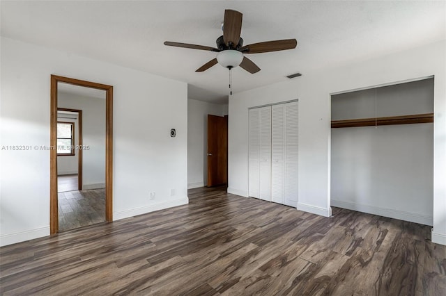 576 Marshall Rd, West Palm Beach, FL 33413 - unfurnished bedroom with wood finished floors, two closets, and a ceiling fan