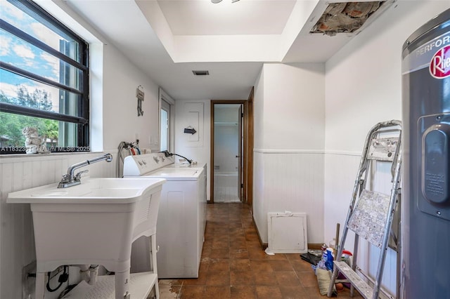 576 Marshall Rd, West Palm Beach, FL 33413 - laundry room featuring washing machine and clothes dryer, wainscoting, and wooden walls
