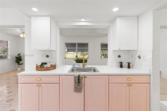 5706 NW 81st Ave, Tamarac, FL 33321 - kitchen with healthy amount of natural light, tasteful backsplash, a ceiling fan, and recessed lighting