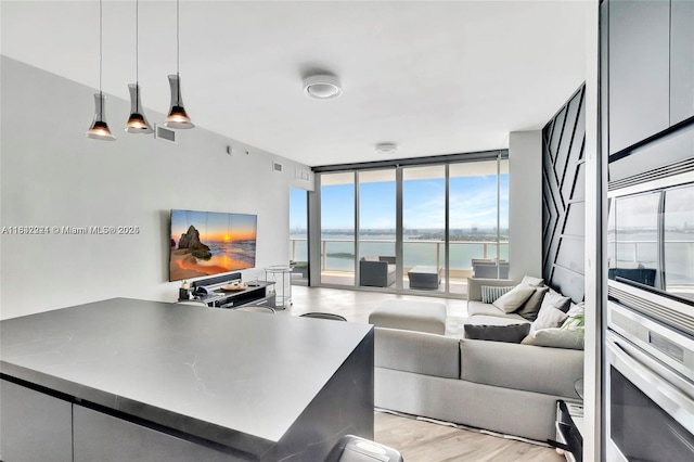2020 N Bayshore Dr Unit 3408, Miami, FL 33137 - living room with floor to ceiling windows and light wood-style flooring
