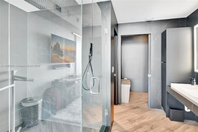 2020 N Bayshore Dr Unit 3408, Miami, FL 33137 - full bathroom featuring a marble finish shower, vanity, and wood finished floors