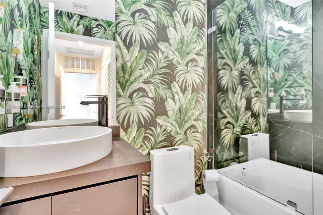 2020 N Bayshore Dr Unit 3408, Miami, FL 33137 - bathroom with wallpapered walls, vanity, and a bathtub