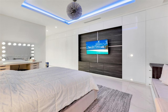 13441 Mustang Trl, Southwest Ranches, FL 33330 - tiled bedroom featuring a tray ceiling