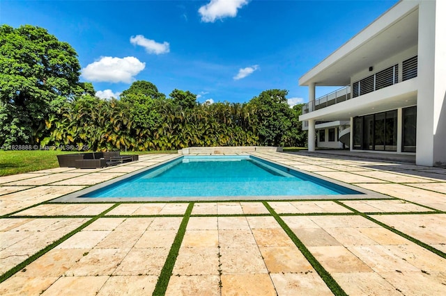 13441 Mustang Trl, Southwest Ranches, FL 33330 - outdoor pool featuring a patio and outdoor lounge area