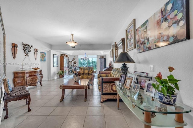 10700 NW 66th St Unit 308, Doral, FL 33178 - living room featuring light tile patterned floors and a chandelier