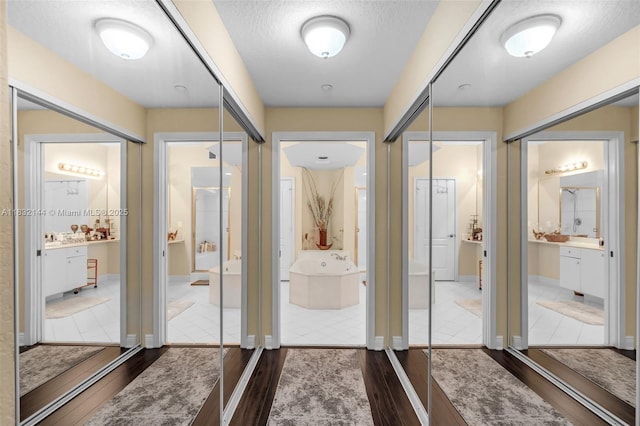 10700 NW 66th St Unit 308, Doral, FL 33178 - corridor with dark wood-style flooring