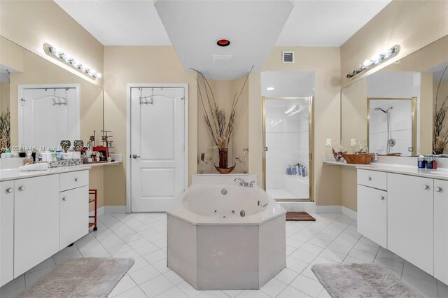 10700 NW 66th St Unit 308, Doral, FL 33178 - bathroom with a stall shower, a jetted tub, two vanities, and tile patterned floors
