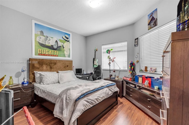10700 NW 66th St Unit 308, Doral, FL 33178 - bedroom with light wood finished floors