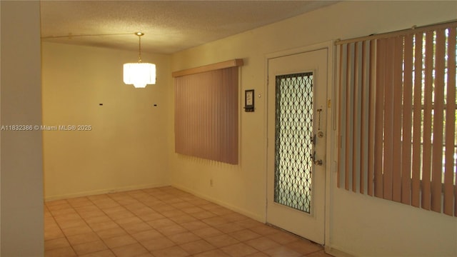 13250 SW 7th Ct Unit 313L, Pembroke Pines, FL 33027 - empty room featuring a chandelier and a textured ceiling