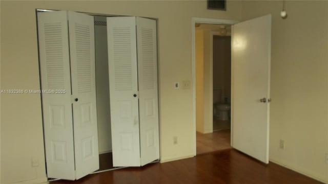 13250 SW 7th Ct Unit 313L, Pembroke Pines, FL 33027 - unfurnished bedroom featuring a closet and wood finished floors