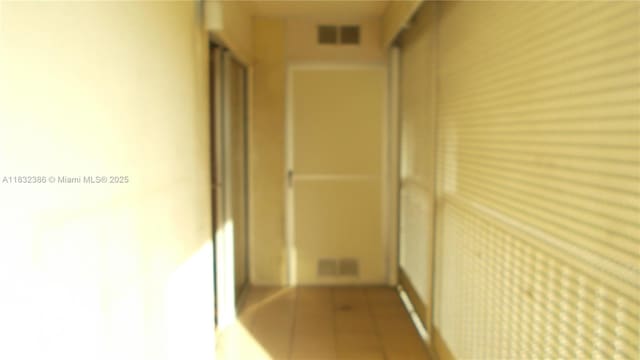 13250 SW 7th Ct Unit 313L, Pembroke Pines, FL 33027 - corridor featuring tile patterned flooring