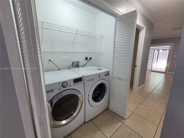 7145 NW 173rd Dr Unit 1108, Hialeah, FL 33015 - laundry area featuring washing machine and dryer and light tile patterned flooring